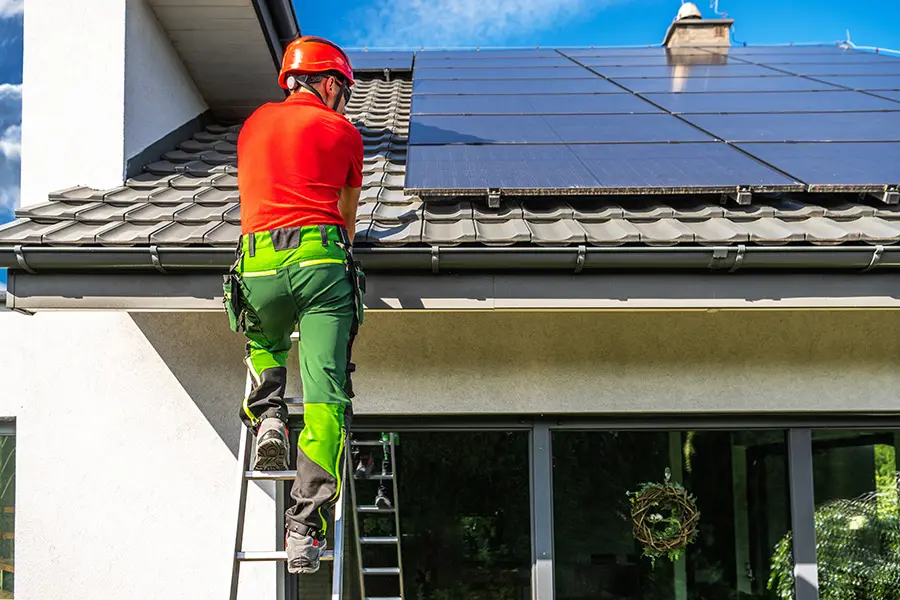 man installing solar